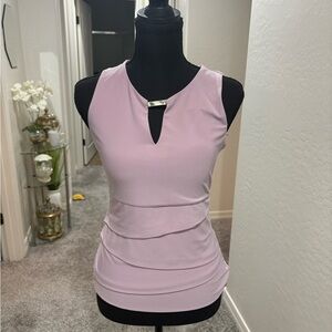 White House Black Market lavender top with silver accent. Size: XS